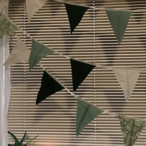 Bunting in greens and white with patterns of flora and fauna.